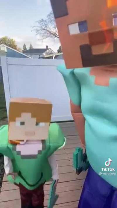 Chad and his kid show off their costumes.