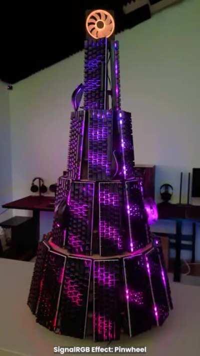 Built a Christmas tree made of 60% mechanical RGB keyboards! All of the keyboards are synced using our SignalRGB application. Was told you guys would appreciate it if I posted here too.