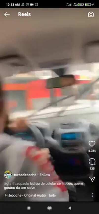 Motorista cabuloso perseguindo ladrão de celular