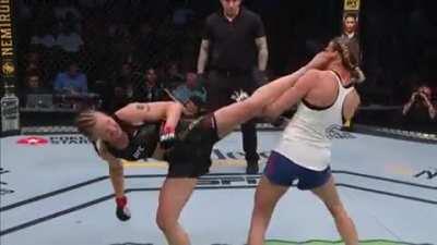 Valentina Shevchenko lands a wheel kick on Katlyn Chookagian