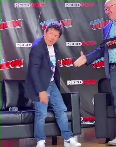The crowd goes wild when movie legends Christopher Lloyd and Michael J Fox (who has Parkinsons) reunite at New York Comicon 2022