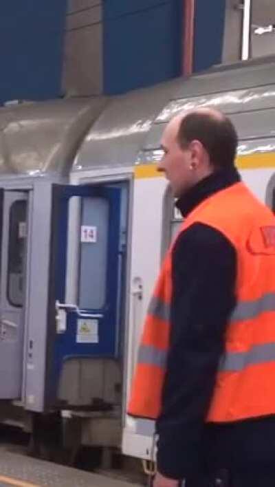 An older man having a great time in the subway