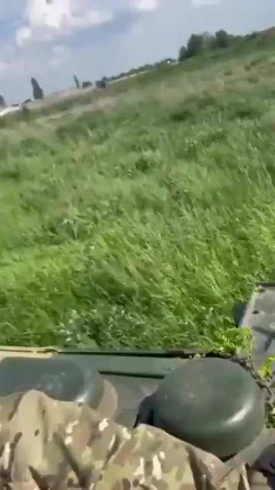 Solider launches drone from a truck while wearing a VR headset