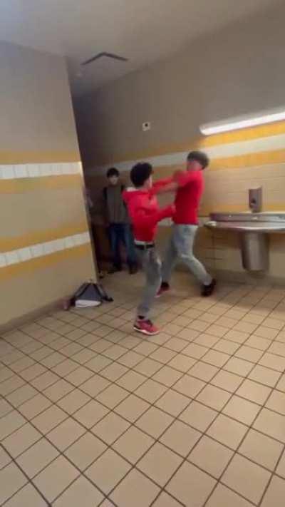 Two Latinos Fighting in the Bathroom