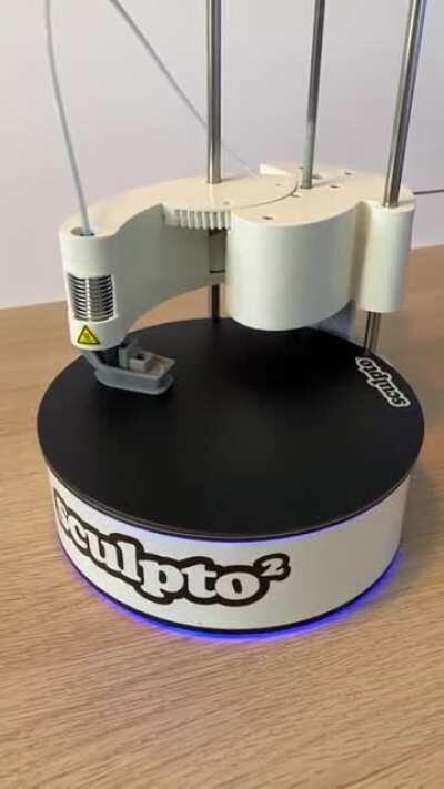 Polar printer with a spinning build platform