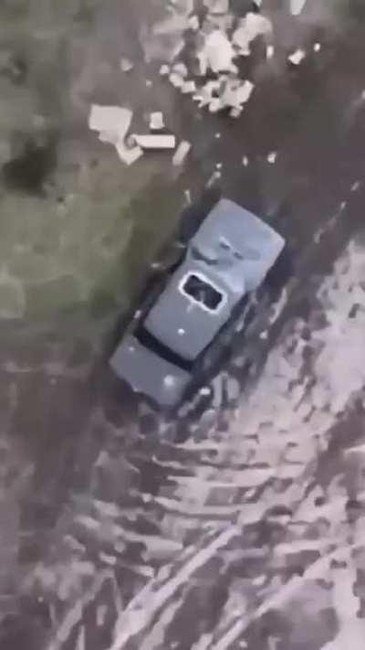 Bulls eye - Ukrainian drone drops munition on russian soldiers directly through the sunroof