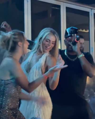 Katie and her friends having fun at the party