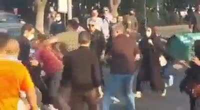 Man hits women not wearing hijab in Iran during the protest, other men show him the error of his ways
