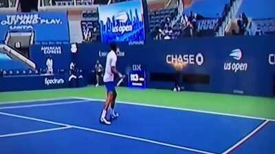 Joker's no-look forehand to the ball girl's throat