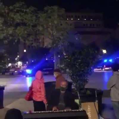 A man in Spain calmly plays the piano as Barcelona explodes into chaos all around him.