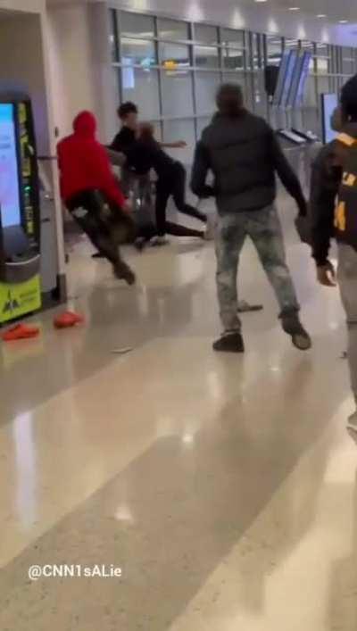 Airport melee but with 'What a wonderful world' as background music