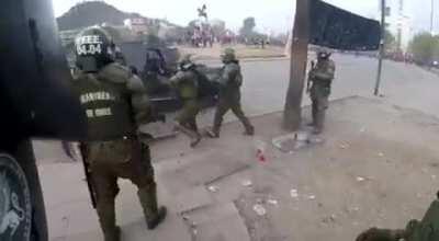 Police girl getting hit by a molotov during protest in Chile.