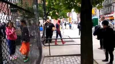 Andrew Garfield playing basketball with kids during his break filming Amazing Spiderman 2.