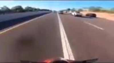 Idiot on a bike splitting lanes at well over 100mph.