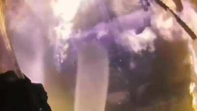 This Fireman fighting his way up a stairwell in order to put a fire out in the attic trusses of a home