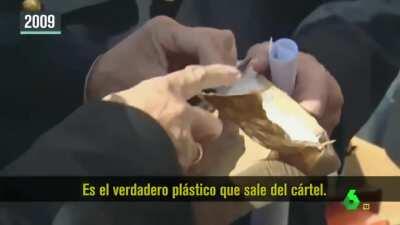 WCGW opening a package full of coke in front of the cameras to show the marks dealers put on them.