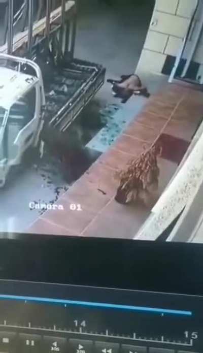 Broken glass cuts a man in the street