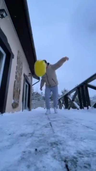 Film cool slo-mo of water balloon physics. Add self kicking balloon to equation. Win prize and sore coccyx.