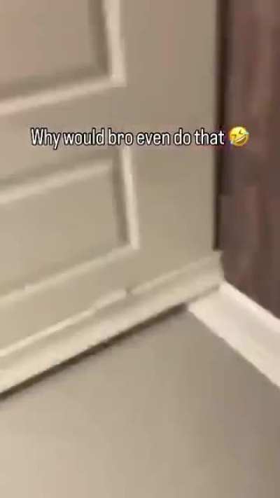 Pointing a gun at his junk