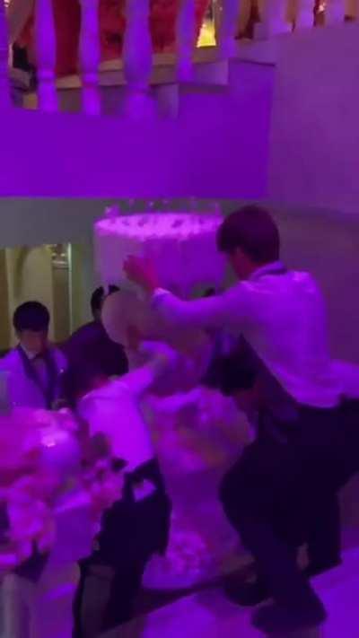 Carrying a big cake