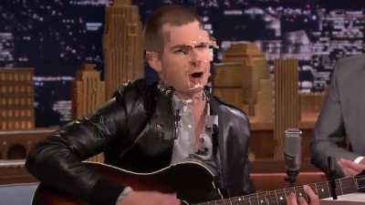 Andrew Garfield serenades the audience with an acoustic version of the Spider-Man theme song.