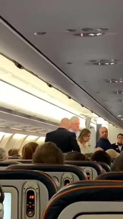 Man demands handshake on airplane