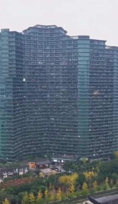 The Regent International apartment building in China is home to around 20k people. The building is 206 meters tall and has 36 to 39 floors, a giant food court, as well as swimming pools, barber shops, nail salons, medium-sized supermarkets, and internet c