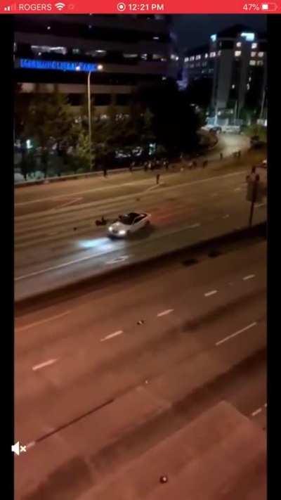 Protesters standing in the middle of a highway