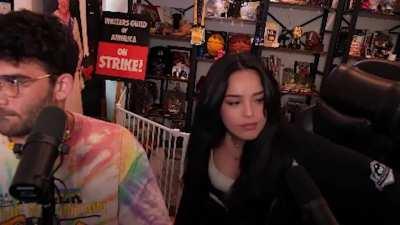 rae nearly falls off chair