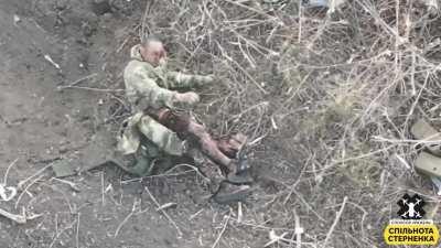 NSFW - wounded Russian soldier is hit by a Ukrainian FPV Kamikaze Drone