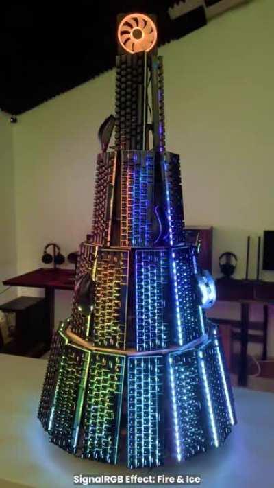 Built a Christmas tree entirely out of RGB keyboards, mice, and a fan as the star!