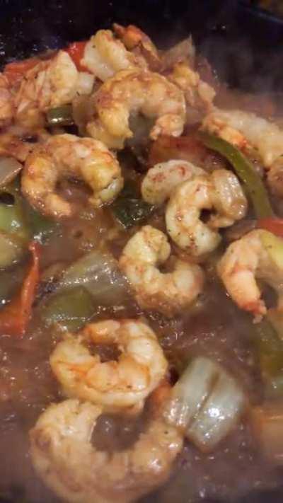 Spicy shrimp and bacon tacos with peppers and onions. Shrimp and bacon hit with a spicy dry rub. Topped with cilantro and a local salsa verde with habaneros from El Nopalito in North San Diego/ Encinitas.