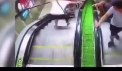 Baby falling down an escalator 
