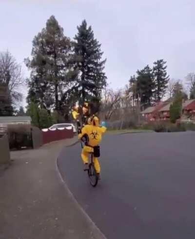 Bagpipping unicyclist
