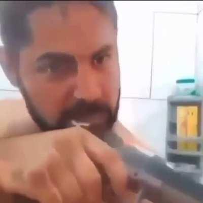 An american brushing his teeth