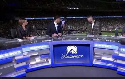 Guy falls off ledge during CBS coverage