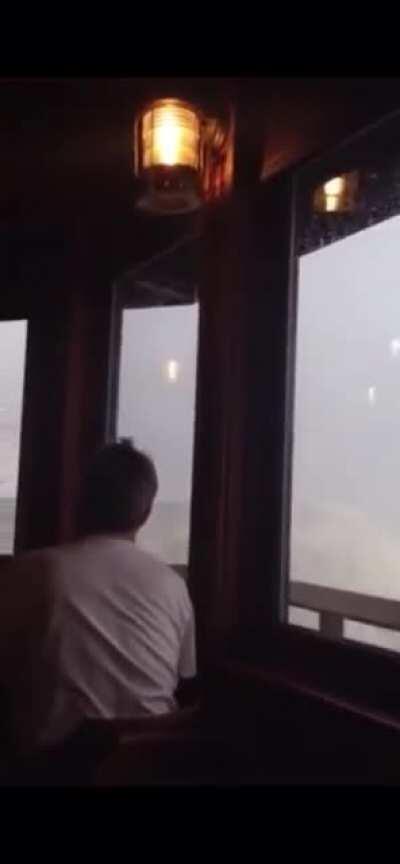 Wave breaks through restaurant