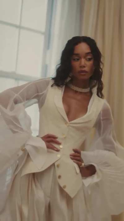 Flamboyant Laura Harrier in white BTS of the Met Gala 2025