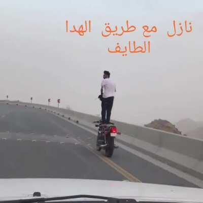 WCGR descending from Mount Hada in taif, Saudi Arabia on a bike with sharp curves.