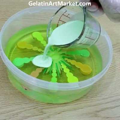 3D worms in sweet fruit jelly. Clear jell-o cake.