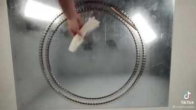 Hover puck racetrack, courtesy of dry ice and magnets!