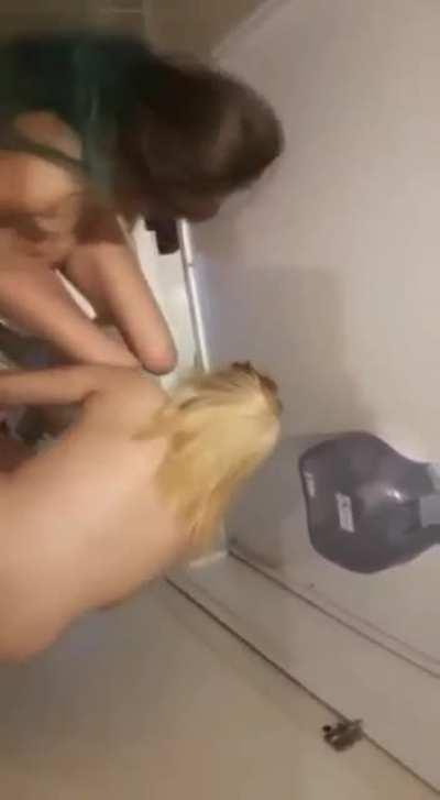 Lesbians in public bathroom