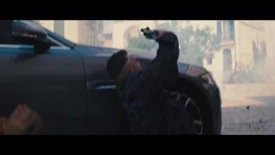 In No Time To Die (2021), Bond is shot at all cylinders of his car, Madeleine tells her to do something and James Bond nods by saying 