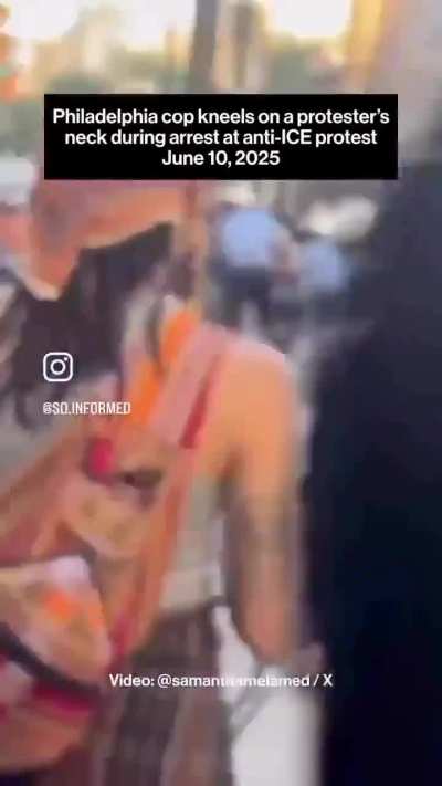 Cop kneeling on a woman's neck while other cops use bikes to shield him from cameras. Philadelphia, PA 6/10/25