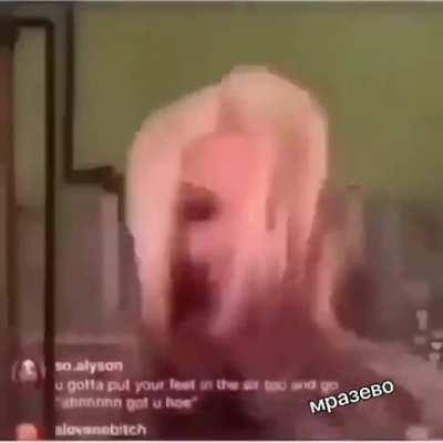 This girl deserves a prize for using a hair straightener on her tongue