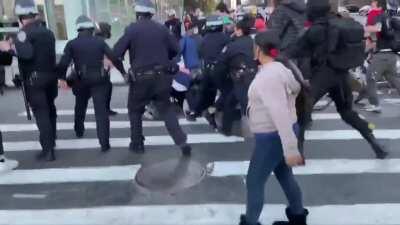 NYPD tackle and arrest protester after she knocks camera from detectives hand - NYC 8th November
