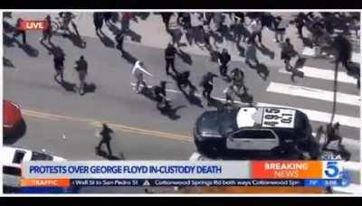 Yet, another cop running a ~5000 pound vehicle into peaceful protesters.