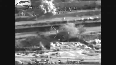 In Iraq, an AH-64D Apache Gunship engages a group of IAI insurgents with a hellfire missile. (Mid 2000s)