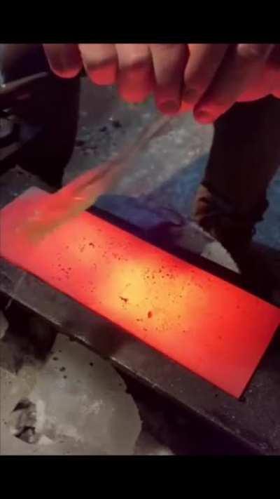 Cracking an agg over hot metal slab
