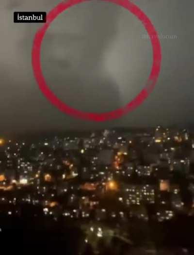 Tesla silhouette appearing in the sky of istanbul